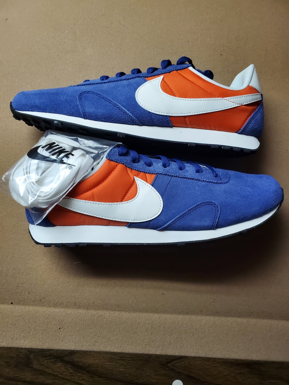 Nike Blue Suede Sneakers with Orange Accents
